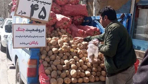 In Wartime Iran Vegetable Seller Offers Free Potatoes to Needy